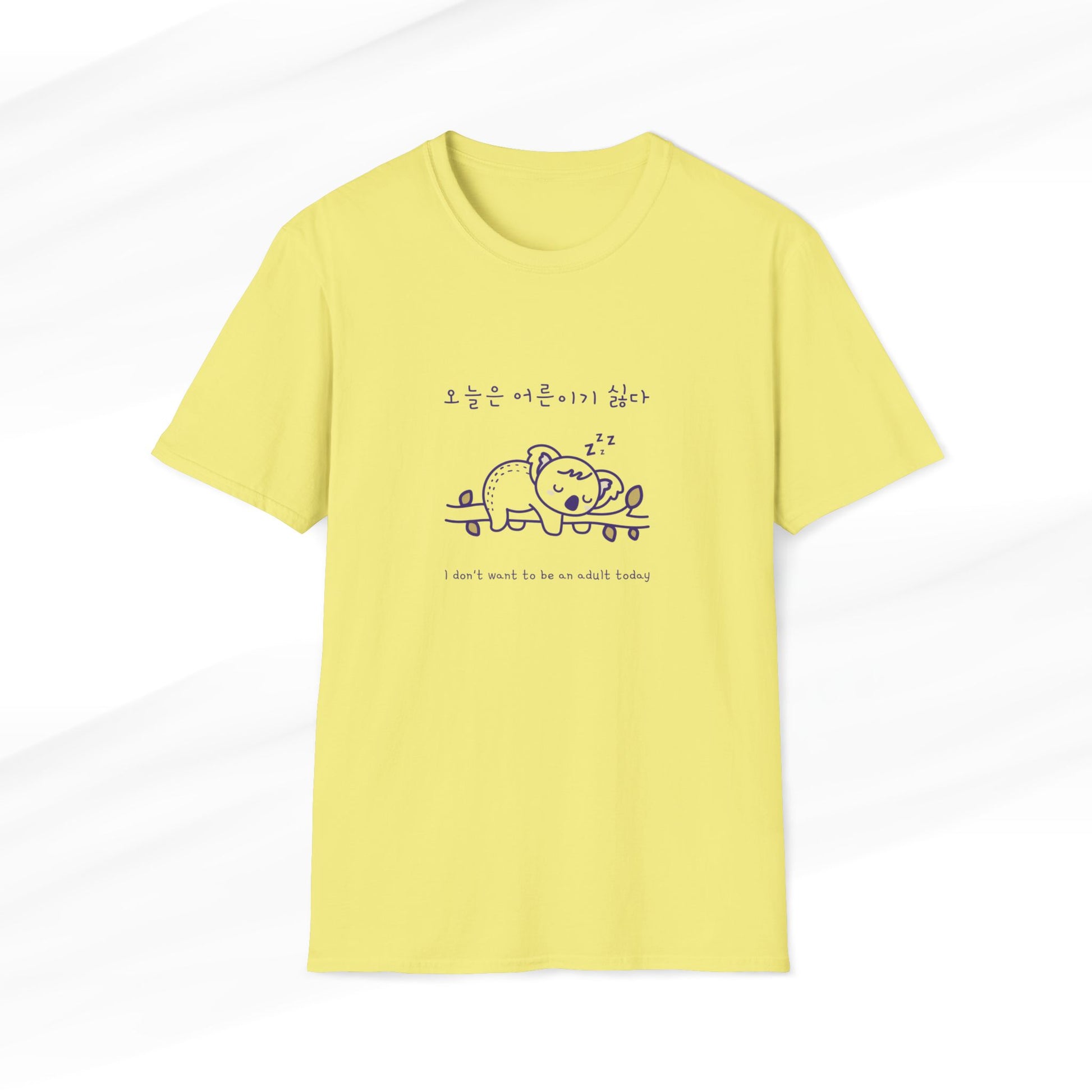 Cornsilk t-shirt featuring a cute koala design with a Korean slogan and the text 'I don’t want to be an adult today,' perfect for animal lovers and lazy days.