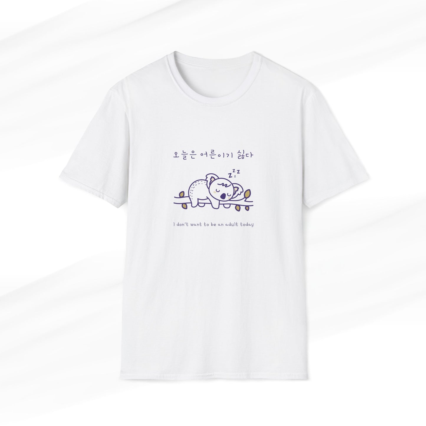 White t-shirt featuring a cute koala design with a Korean slogan and the text 'I don’t want to be an adult today,' perfect for animal lovers and lazy days.