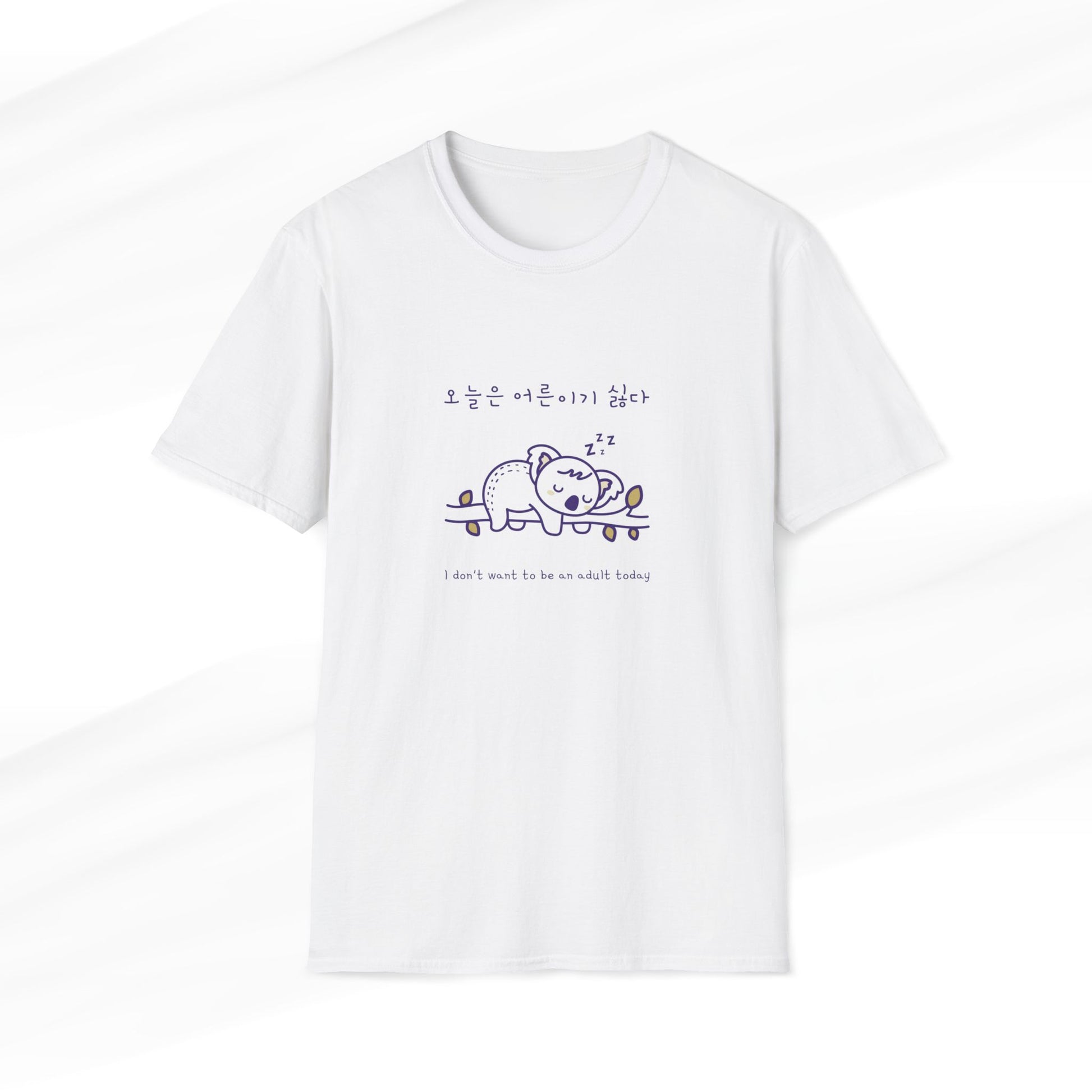 White t-shirt featuring a cute koala design with a Korean slogan and the text 'I don’t want to be an adult today,' perfect for animal lovers and lazy days.